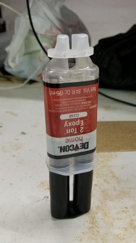 Store epoxy syringes open end up